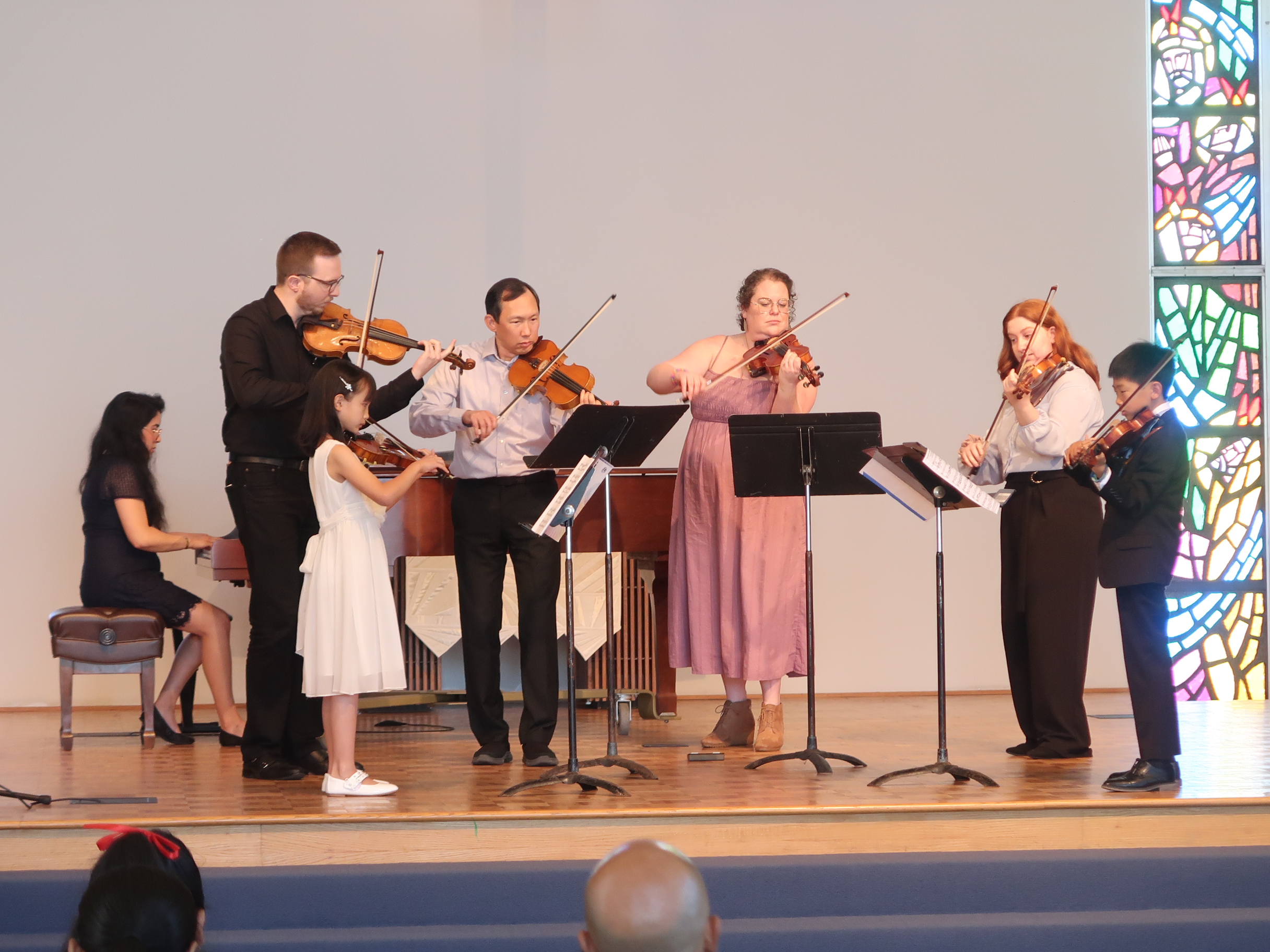 Student ensemble performing on stage
