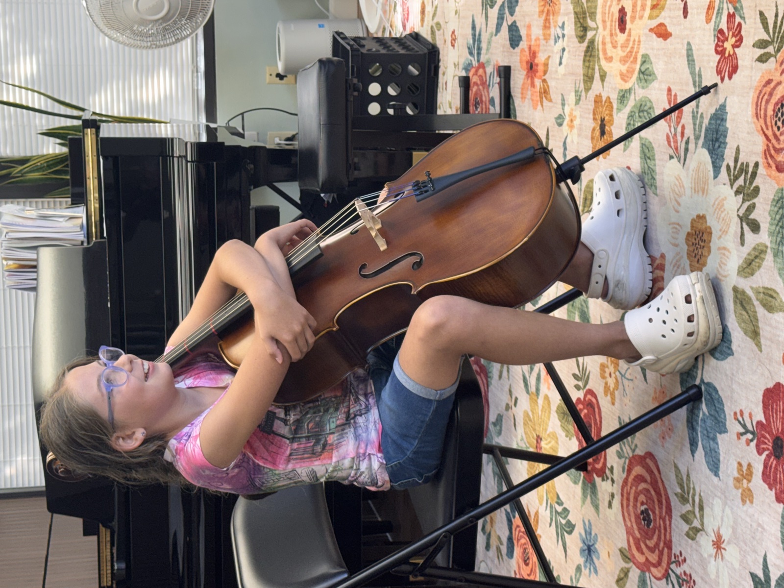 Young student holding a cello