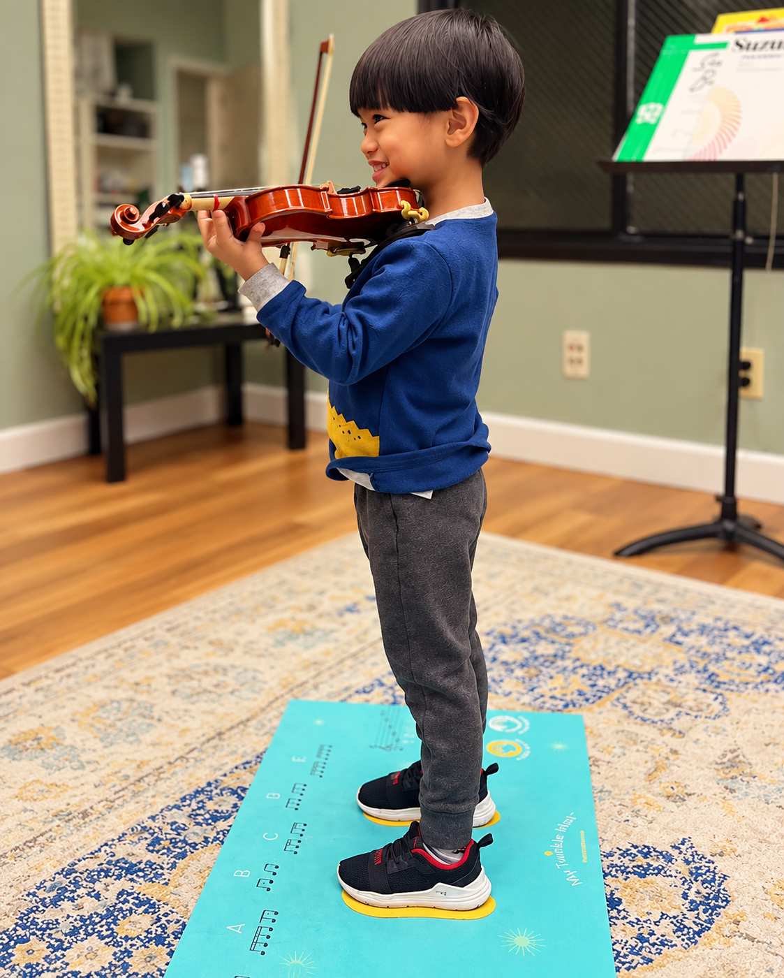 Young student holding a violin